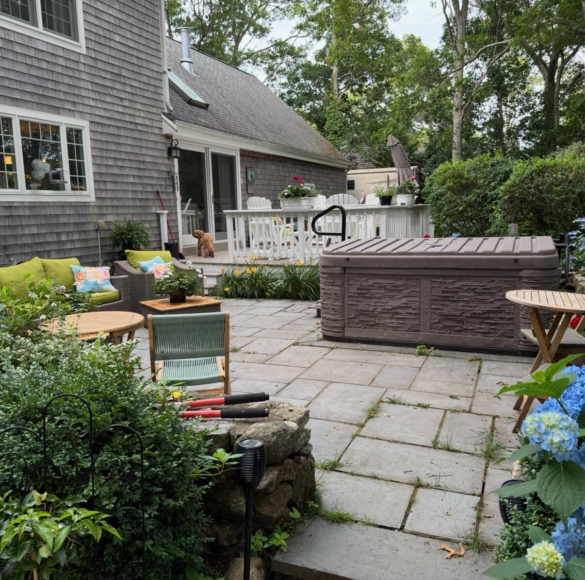 48 Holly Ridge Drive Sandwich, MA 02563 - Photo 45 of 48 a view of a chairs and tables in the back yard of the house