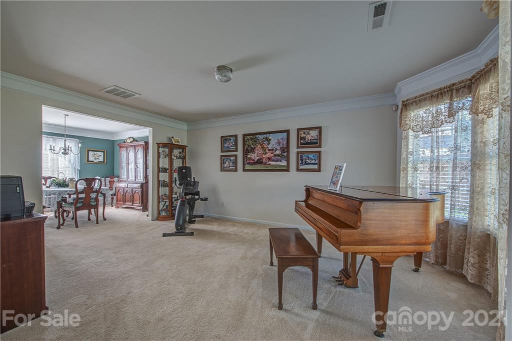 5202 Sunriver Road Gastonia, NC 28054 - Photo 5 of 29 a view of a livingroom with furniture and a window