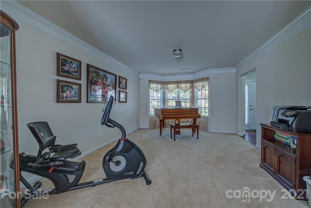 5202 Sunriver Road Gastonia, NC 28054 - Photo 6 of 29 a view of a room with gym equipment