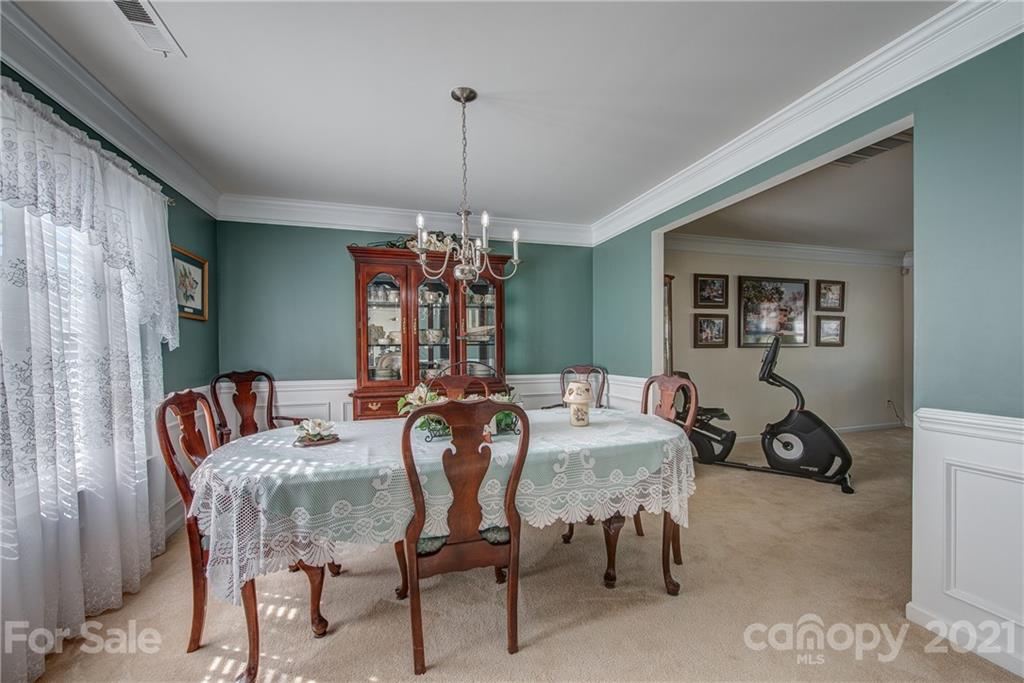 5202 Sunriver Road Gastonia, NC 28054 - Photo 7 of 29 a view of a dining room with furniture window and outside view
