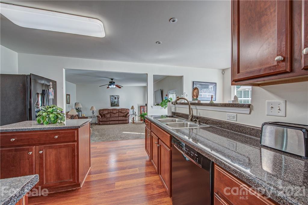 5202 Sunriver Road Gastonia, NC 28054 - Photo 10 of 29 a kitchen with sink stove and cabinets