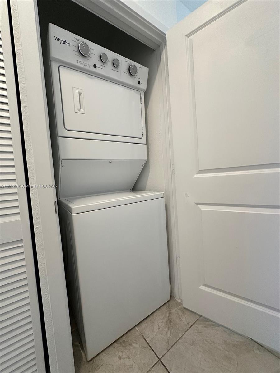25338 Southwest 135th Avenue, Unit 107 Homestead, FL 33032 - Photo 13 of 26 a utility room with dryer and washer
