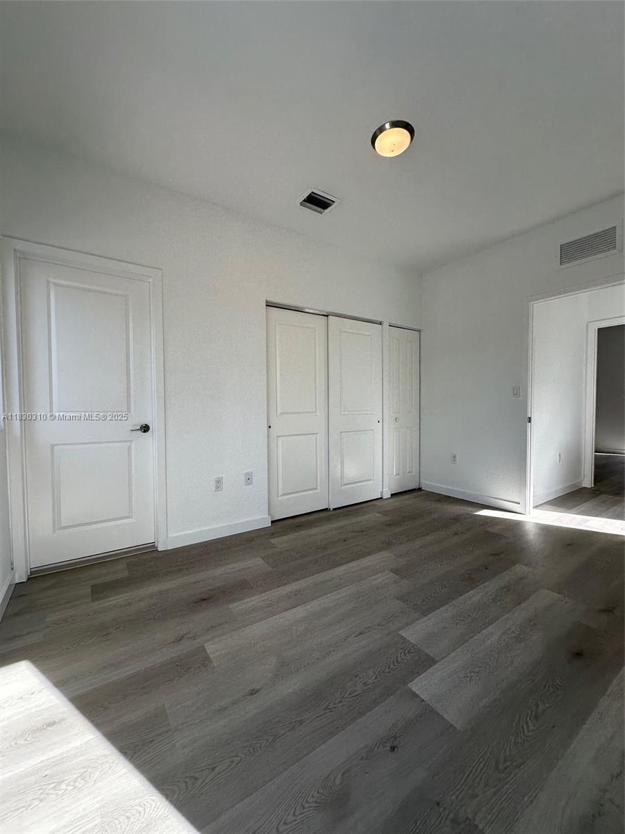 25338 Southwest 135th Avenue, Unit 107 Homestead, FL 33032 - Photo 16 of 26 a view of an empty room