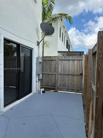 a view of outdoor space with wooden fence