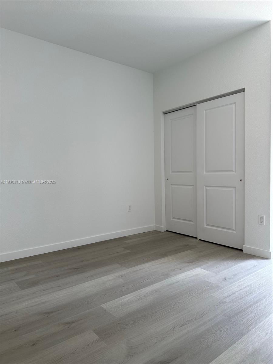 25338 Southwest 135th Avenue, Unit 107 Homestead, FL 33032 - Photo 10 of 26 a view of an empty room