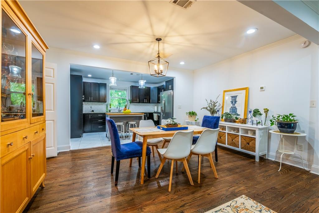 1760 Rogers Avenue Southwest Atlanta, GA 30310 - Photo 14 of 57 a view of a dining room with furniture window and wooden floor