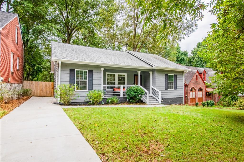 1760 Rogers Avenue Southwest Atlanta, GA 30310 - Photo 2 of 57 a front view of a house with a yard