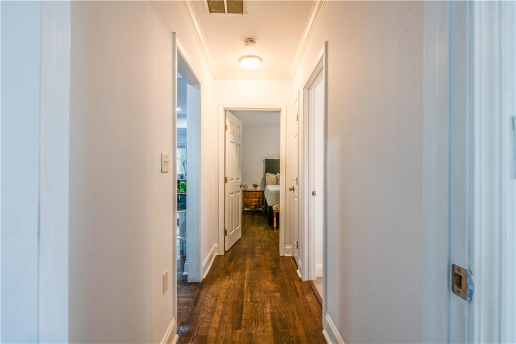1760 Rogers Avenue Southwest Atlanta, GA 30310 - Photo 22 of 57 a view of a hallway with wooden floor and a bathroom