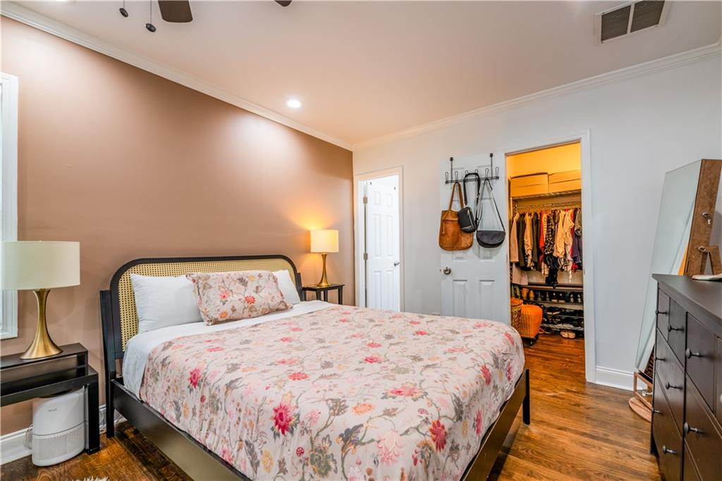 1760 Rogers Avenue Southwest Atlanta, GA 30310 - Photo 24 of 57 a bedroom with bed and wooden floor