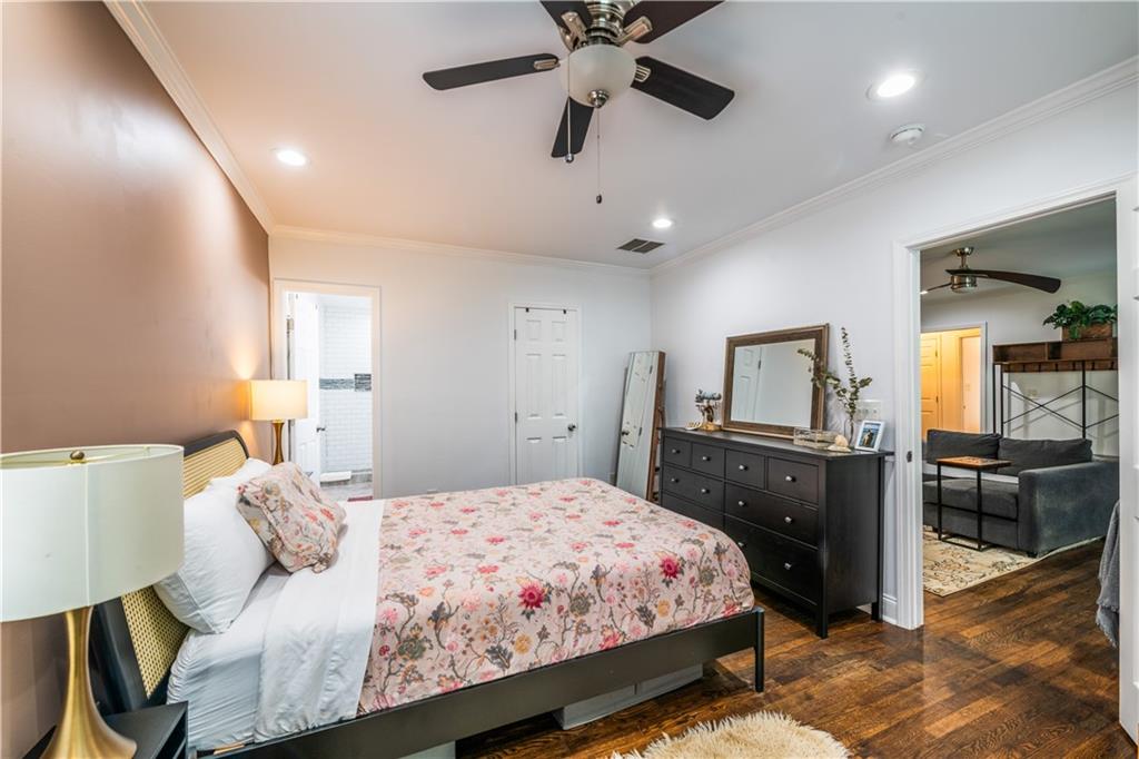 1760 Rogers Avenue Southwest Atlanta, GA 30310 - Photo 26 of 57 a bedroom with a bed and wooden floor