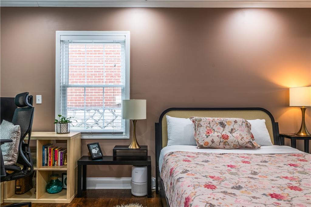1760 Rogers Avenue Southwest Atlanta, GA 30310 - Photo 27 of 57 a bedroom with a bed and a book shelf
