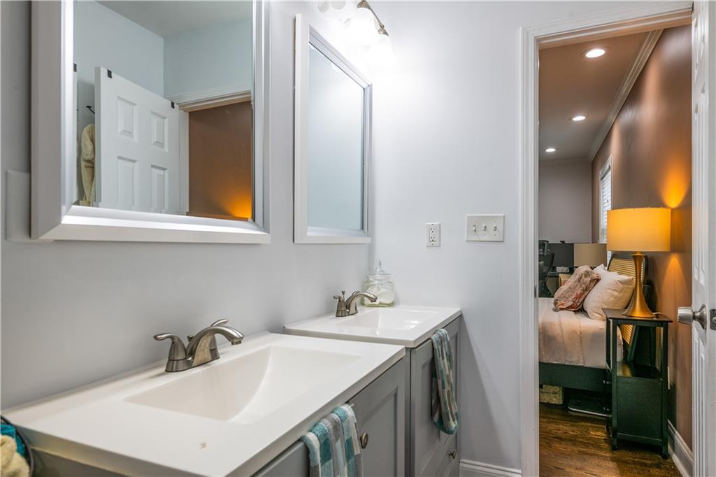 1760 Rogers Avenue Southwest Atlanta, GA 30310 - Photo 28 of 57 a bathroom with a sink vanity and a mirror