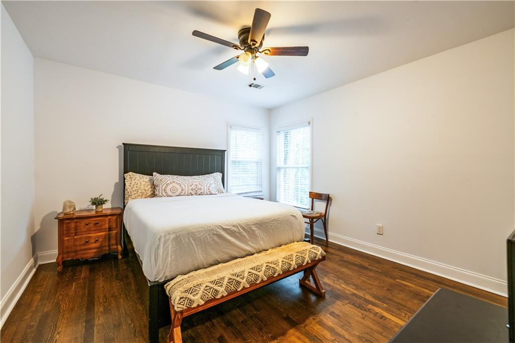 1760 Rogers Avenue Southwest Atlanta, GA 30310 - Photo 34 of 57 a bedroom with a bed and a ceiling fan