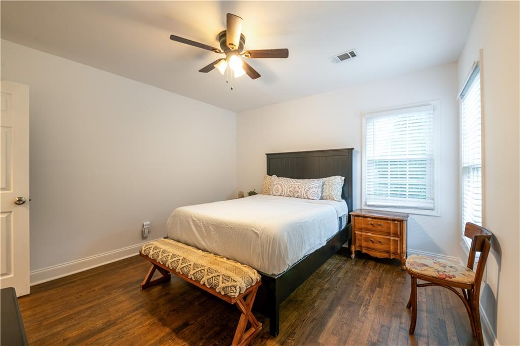 1760 Rogers Avenue Southwest Atlanta, GA 30310 - Photo 35 of 57 a bedroom with a bed and a chandelier