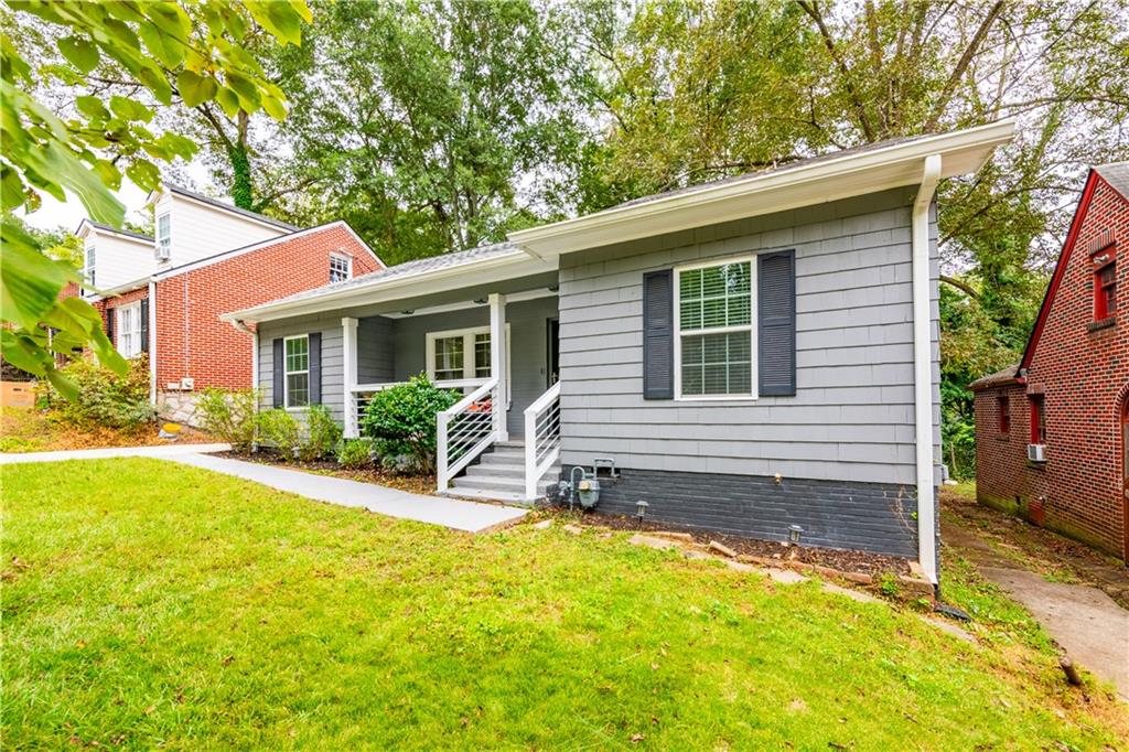 1760 Rogers Avenue Southwest Atlanta, GA 30310 - Photo 4 of 57 a view of a house with backyard and sitting area