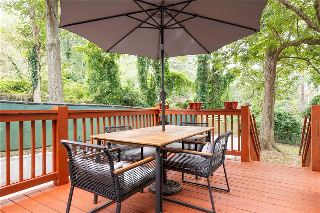 1760 Rogers Avenue Southwest Atlanta, GA 30310 - Photo 47 of 57 a view of a wooden chairs and table in the deck