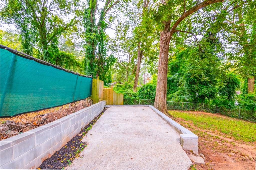 1760 Rogers Avenue Southwest Atlanta, GA 30310 - Photo 55 of 57 a view of a backyard with a garden