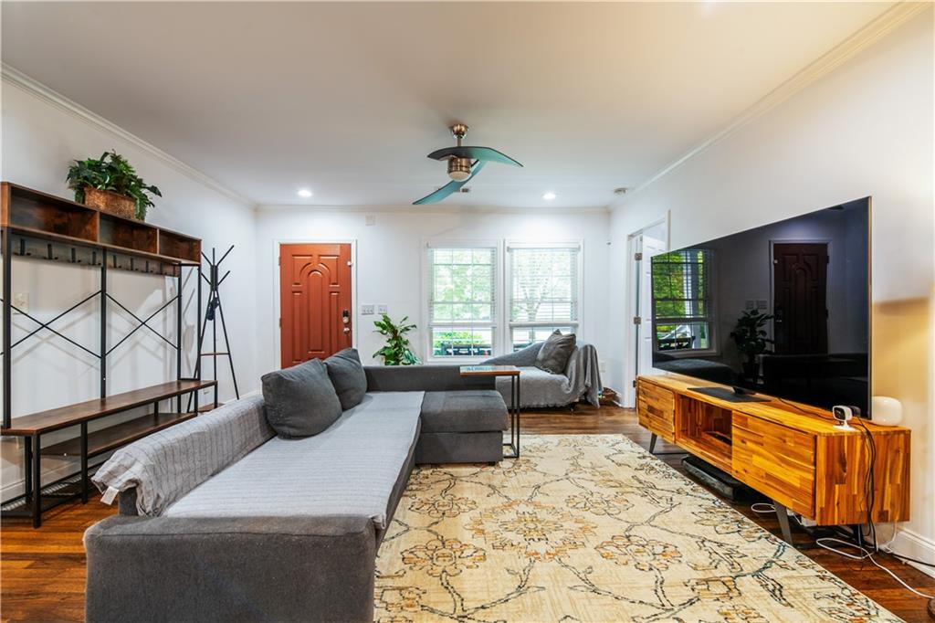 1760 Rogers Avenue Southwest Atlanta, GA 30310 - Photo 9 of 57 a living room with furniture a flat screen tv and a large window