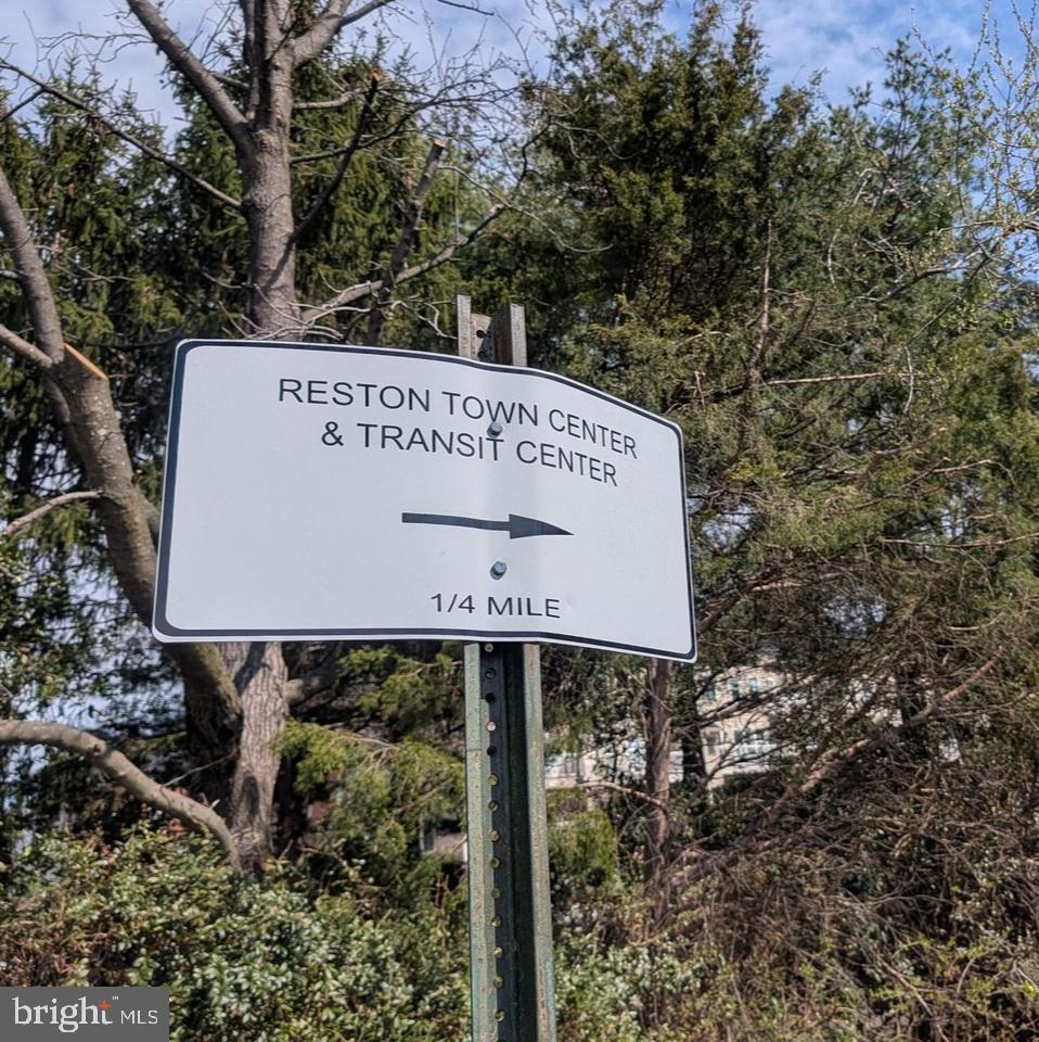 1891 Crescent Park Drive, Unit 110A Reston, VA 20190 - Photo 36 of 41 a view of a sign in a garden