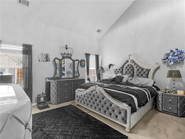 a bedroom with a bed and window