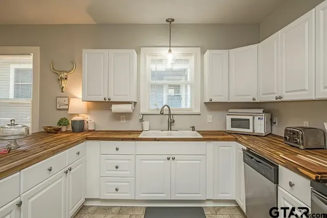 a view of a dining room with a table and chair