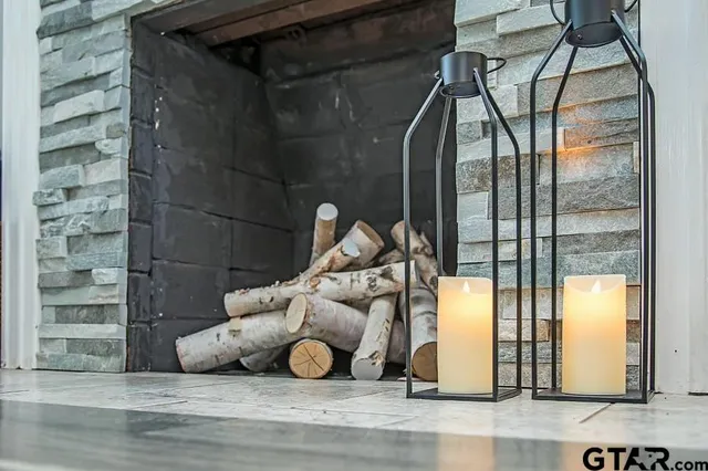 a living room with furniture fireplace and flat screen tv