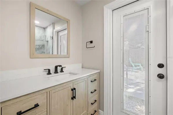 a bathroom with a sink and a mirror