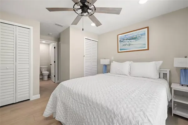 a bedroom with a bed and a view of bedroom