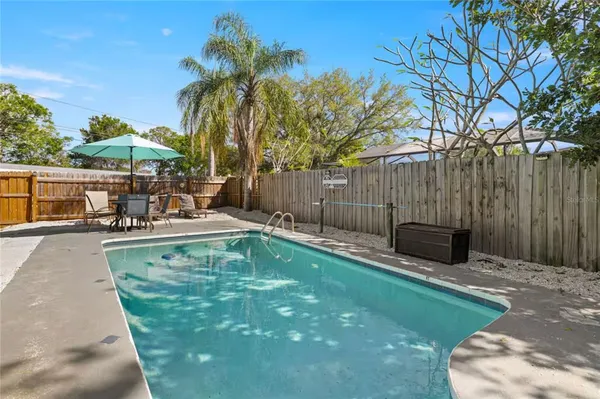 a view of a swimming pool with a patio