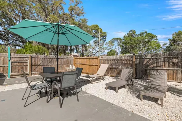 an outdoor space with furniture and umbrella