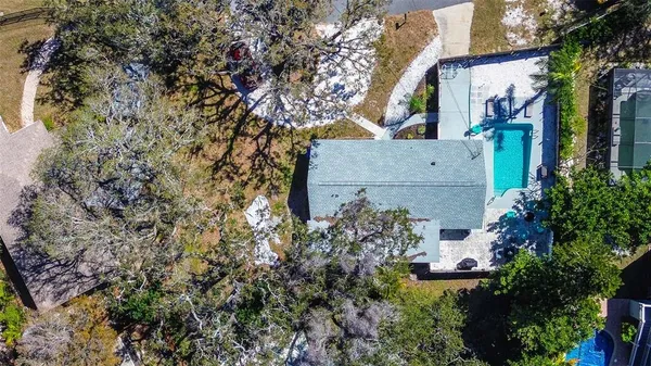 front view of a house with a tree
