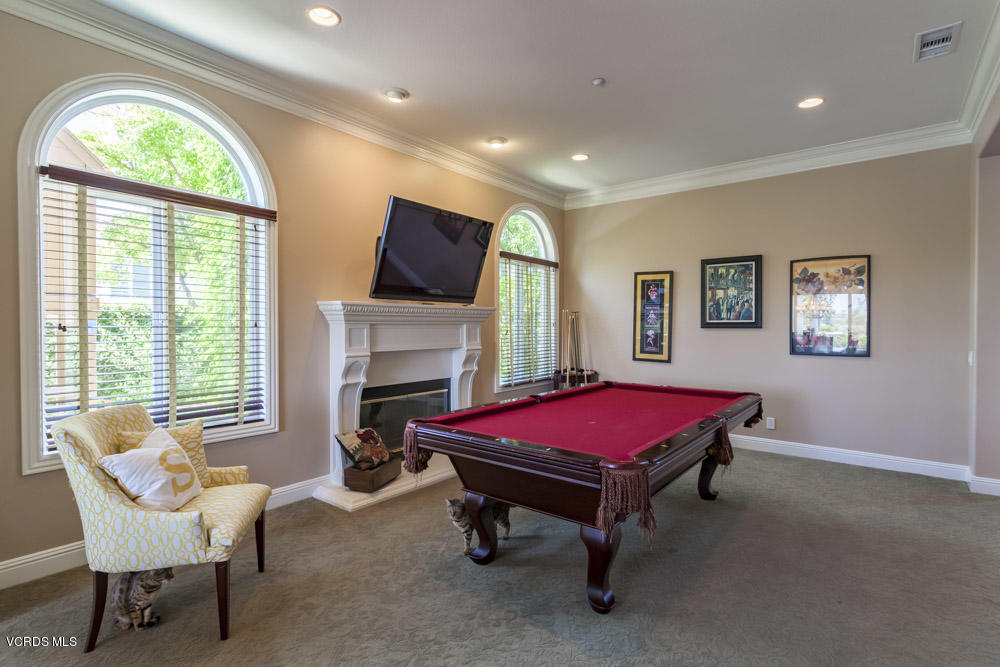 12054 Nelson Road Moorpark, CA 93021 - Photo 13 of 75 a room with furniture a rug and a fireplace