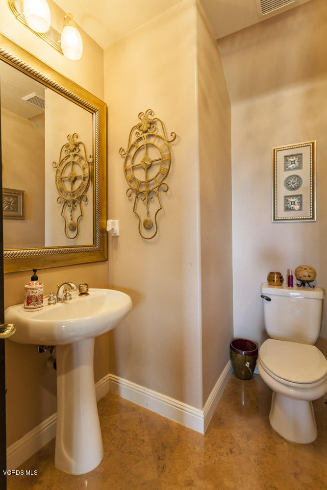 12054 Nelson Road Moorpark, CA 93021 - Photo 30 of 75 a bathroom with a sink mirror and toilet