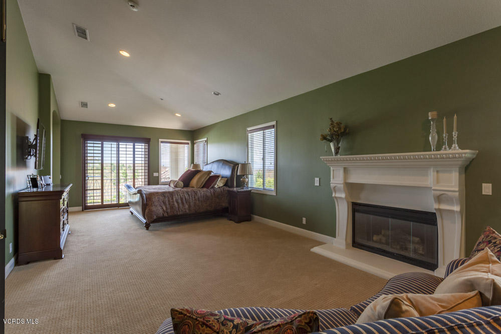 12054 Nelson Road Moorpark, CA 93021 - Photo 36 of 75 a living room with furniture and a fireplace