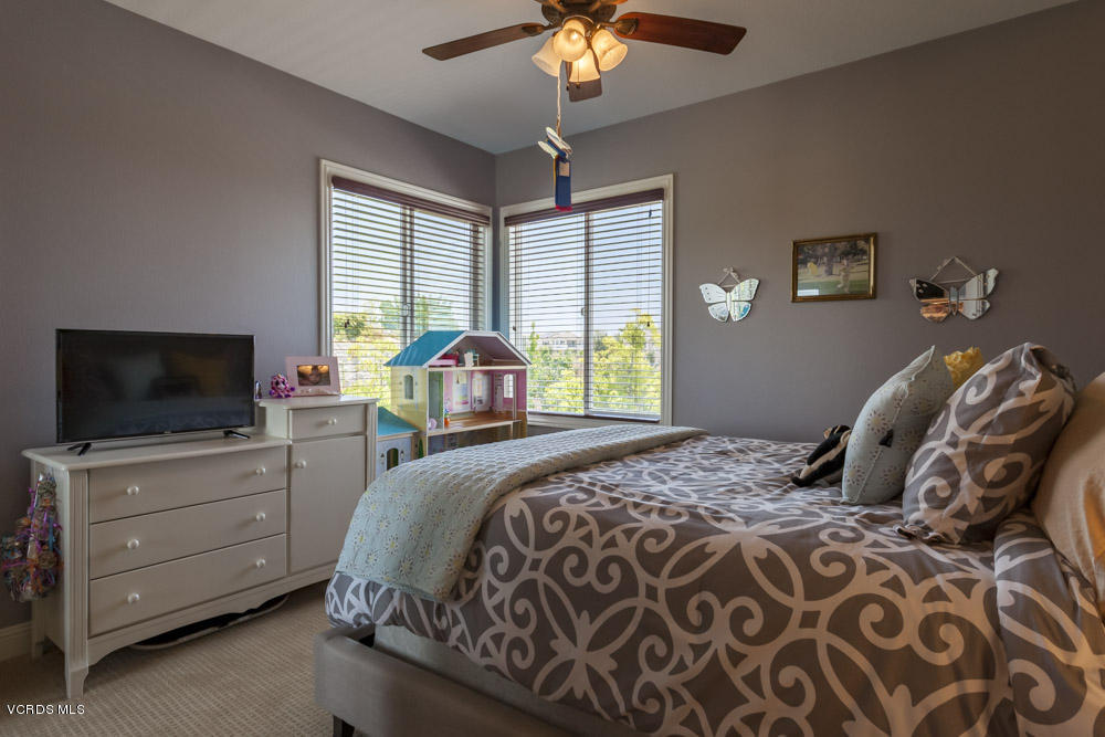12054 Nelson Road Moorpark, CA 93021 - Photo 43 of 75 a bedroom with a bed and a flat screen tv