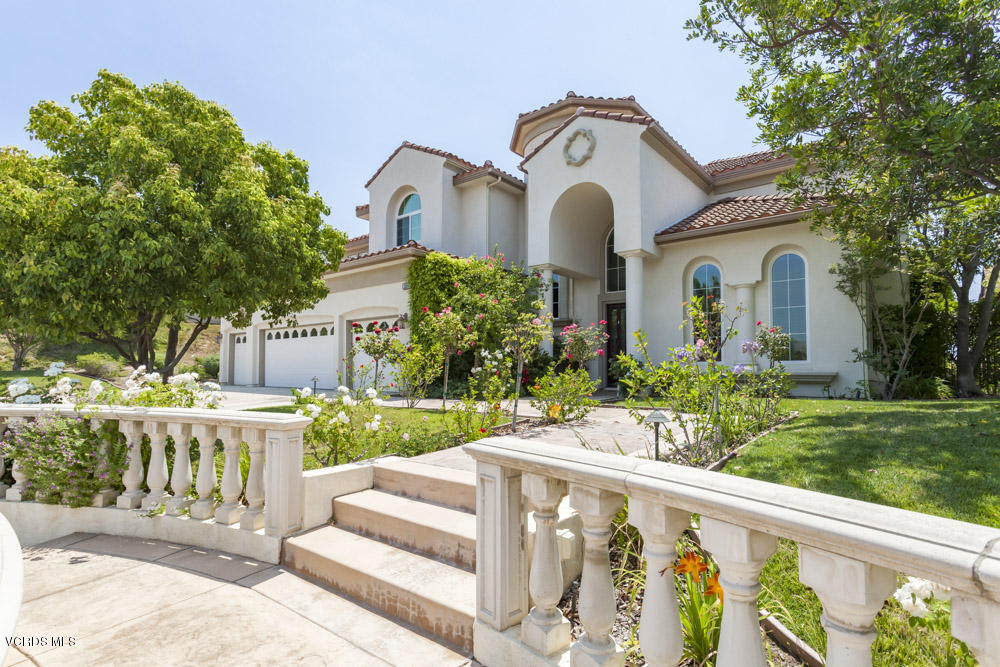 12054 Nelson Road Moorpark, CA 93021 - Photo 6 of 75 a front view of a house with a garden and pathway