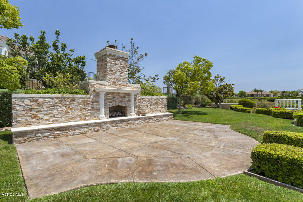 12054 Nelson Road Moorpark, CA 93021 - Photo 53 of 75 a front view of a house with a garden and yard