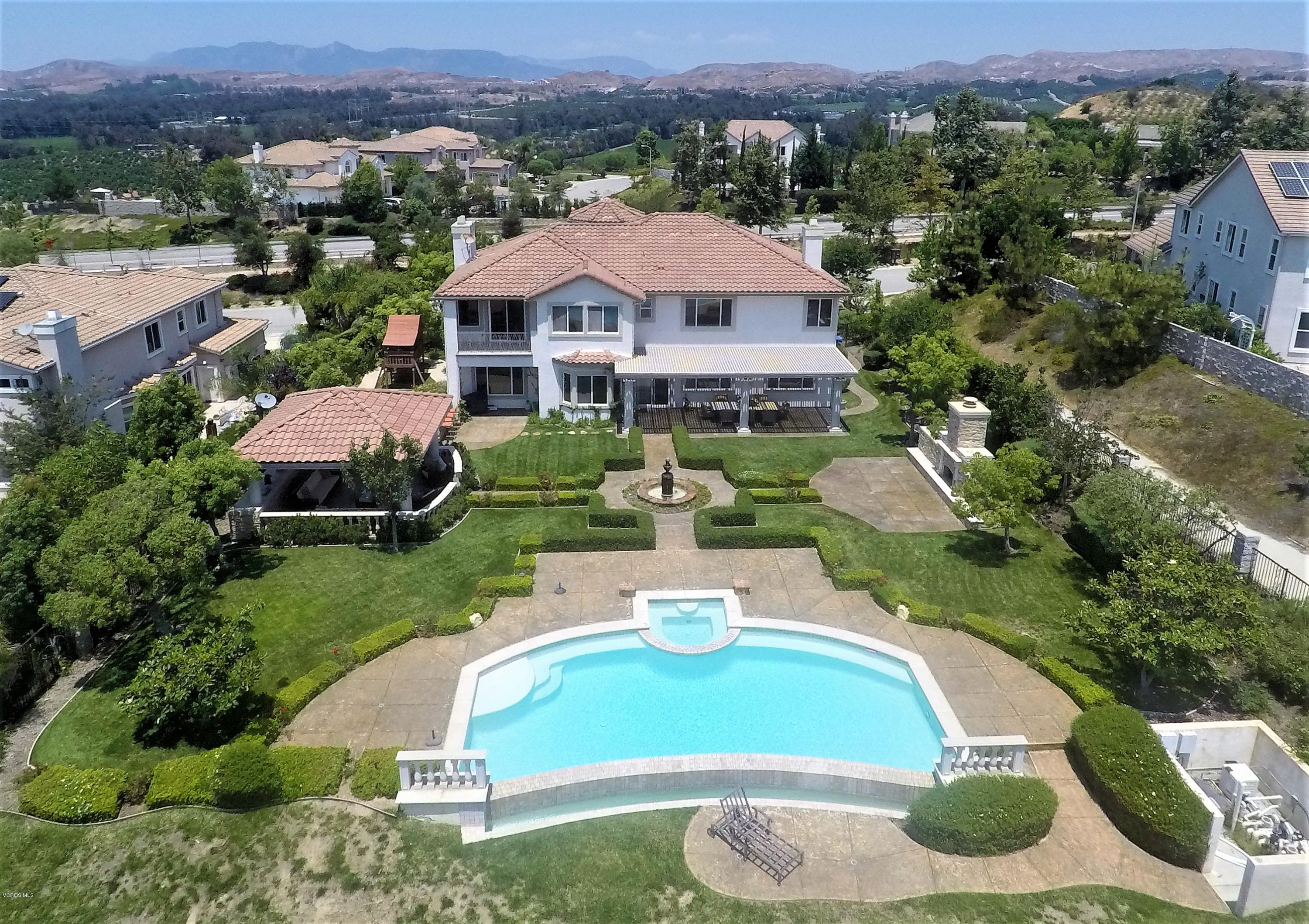 12054 Nelson Road Moorpark, CA 93021 - Photo 70 of 75 an aerial view of a house with a yard and lake