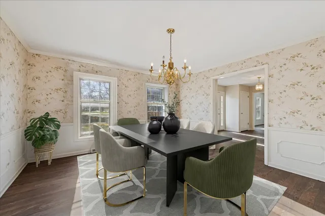 a dining room with furniture and window