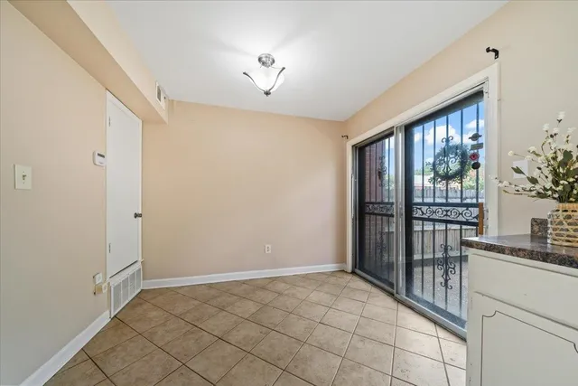 a view of an empty room and window
