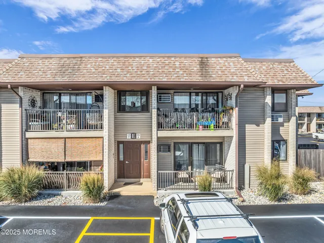 a view of a building with sitting area