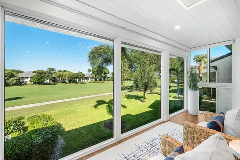 a view of a living room and balcony