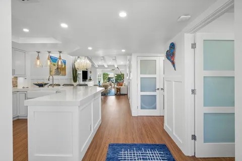 a kitchen with stainless steel appliances granite countertop refrigerator sink and stove