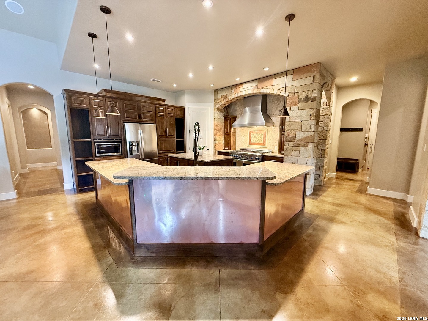 757 Copper Rim Spring Branch, TX 78070 - Photo 10 of 50 a large kitchen with stainless steel appliances kitchen island granite countertop a stove and a sink