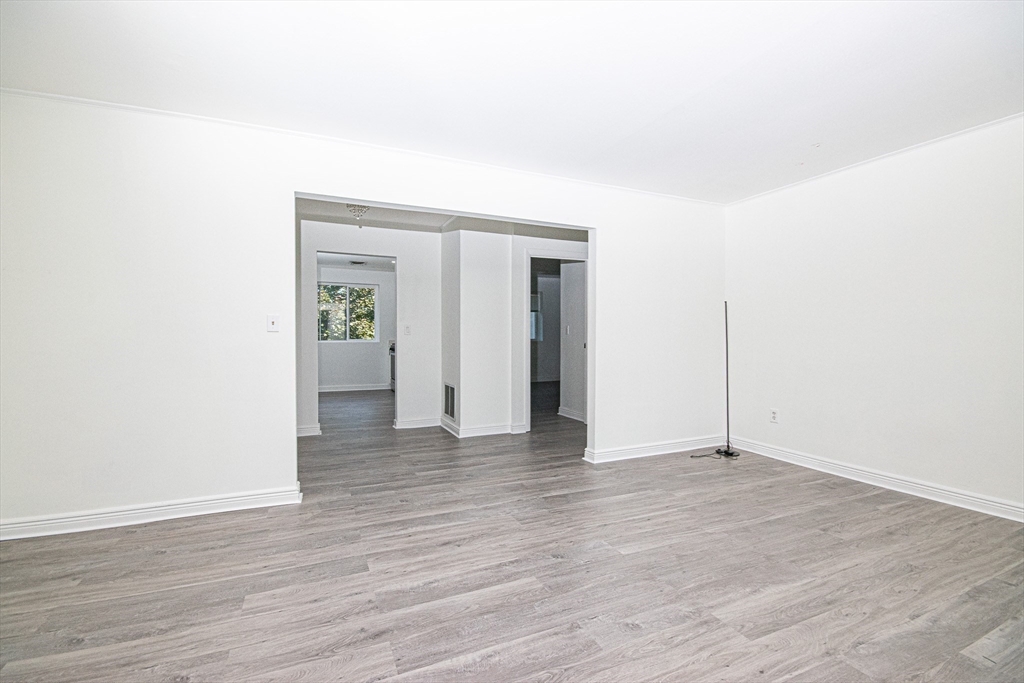 41 Bayberry Drive, Unit 4 Sharon, MA 02067 - Photo 13 of 27 a view of an empty room with wooden floor