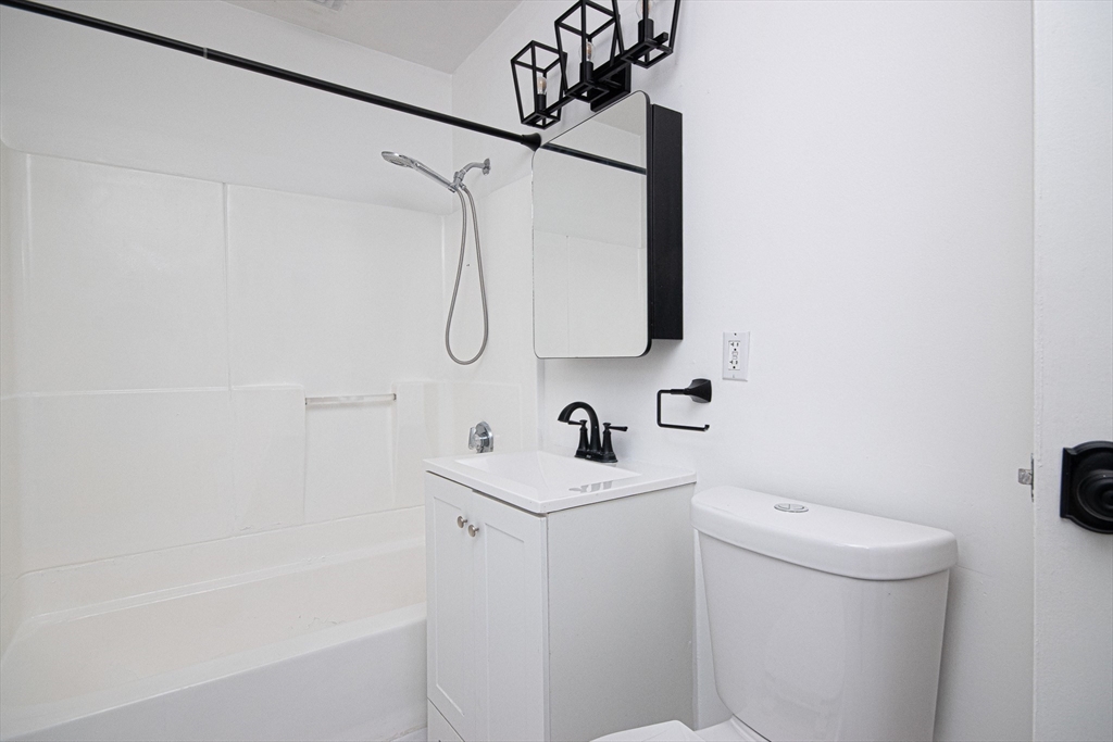 41 Bayberry Drive, Unit 4 Sharon, MA 02067 - Photo 17 of 27 a bathroom with a sink a toilet and shower