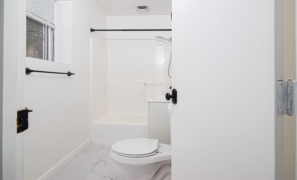 41 Bayberry Drive, Unit 4 Sharon, MA 02067 - Photo 18 of 27 a white toilet sitting next to a shower