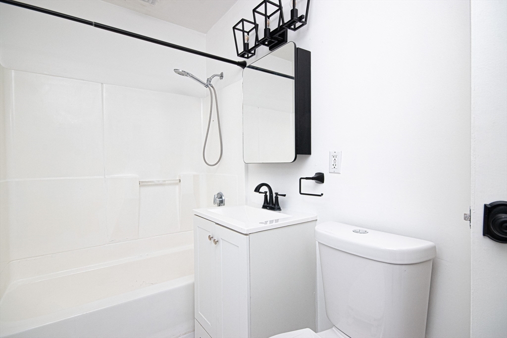 41 Bayberry Drive, Unit 4 Sharon, MA 02067 - Photo 19 of 27 a bathroom with a sink a toilet and shower