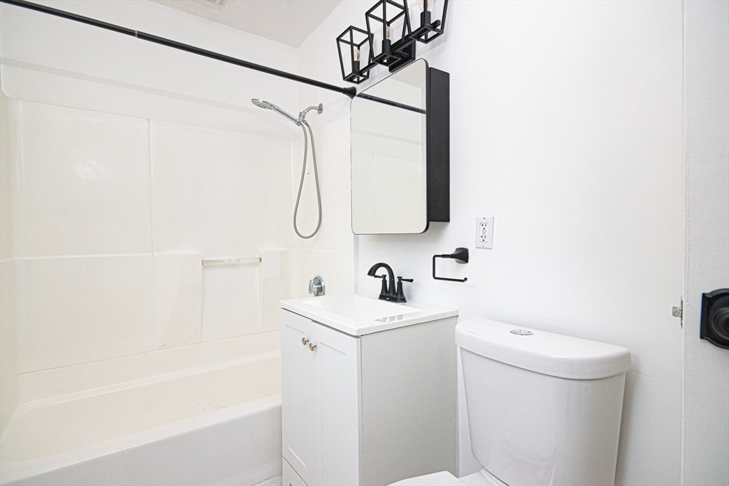 41 Bayberry Drive, Unit 4 Sharon, MA 02067 - Photo 20 of 27 a bathroom with a sink a toilet and shower