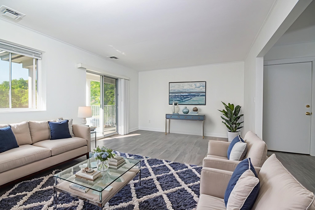 41 Bayberry Drive, Unit 4 Sharon, MA 02067 - Photo 3 of 27 a living room with furniture rug and window